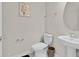 Clean and updated half bathroom with pedestal sink at 3829 Lana Ave, Davenport, FL 33897