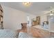 View of living area with terracotta tile floors and a drop leaf table at 5125 Formby Dr, Orlando, FL 32812