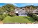 Home's backyard, showing grassy area and a fenced perimeter at 5125 Formby Dr, Orlando, FL 32812