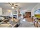 Open living area with tile floors, comfortable seating, and a view into the kitchen at 5125 Formby Dr, Orlando, FL 32812