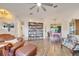 Living room with hardwood floors, built-in shelving, and an open floor plan at 5125 Formby Dr, Orlando, FL 32812