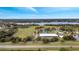 Aerial view of a community park featuring a large lake, playground, and sports facilities at 5125 Formby Dr, Orlando, FL 32812