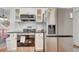 Kitchen with stainless steel appliances and a breakfast bar at 5125 Formby Dr, Orlando, FL 32812