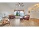 Bright living room with hardwood floors, comfortable furniture, and large windows at 5125 Formby Dr, Orlando, FL 32812