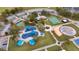 Aerial view of a community park with playground, basketball court, and parking lot at 5125 Formby Dr, Orlando, FL 32812