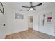Bright bedroom with hardwood floors, ceiling fan and access to bathroom at 5125 Formby Dr, Orlando, FL 32812