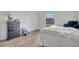 Cozy bedroom with a double bed, dresser, and plenty of natural light at 5125 Formby Dr, Orlando, FL 32812
