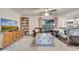 Spacious living room features leather sofas, a large TV, and built-in shelving at 5125 Formby Dr, Orlando, FL 32812
