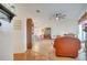 Open living space with hardwood floors, a fireplace, and comfortable seating at 5125 Formby Dr, Orlando, FL 32812