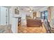 Living room with terracotta floors, ceiling fan, and leather sofa at 5125 Formby Dr, Orlando, FL 32812