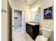Simple bathroom with granite countertop and toilet at 617 Jasmine Ln, Davenport, FL 33897