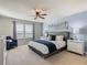 Primary bedroom with king-size bed and stylish decor at 617 Jasmine Ln, Davenport, FL 33897