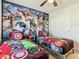 Twin bedroom with Marvel character bedding and mural at 617 Jasmine Ln, Davenport, FL 33897