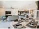 Open concept dining area with marble table and kitchen views at 617 Jasmine Ln, Davenport, FL 33897