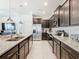 Modern kitchen with stainless steel appliances and granite countertops at 617 Jasmine Ln, Davenport, FL 33897