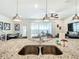 Granite kitchen island with double sink, perfect for casual dining at 617 Jasmine Ln, Davenport, FL 33897