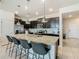 Kitchen island with seating for four and granite countertops at 617 Jasmine Ln, Davenport, FL 33897