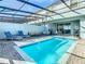 Private screened pool with patio furniture at 617 Jasmine Ln, Davenport, FL 33897