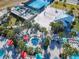 Relaxing pool area with a hot tub and beach volleyball court at 617 Jasmine Ln, Davenport, FL 33897