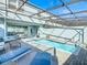 Private screened pool with patio furniture at 617 Jasmine Ln, Davenport, FL 33897