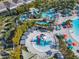 Aerial view of a waterpark with slides and a splash pad at 617 Jasmine Ln, Davenport, FL 33897