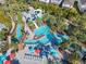 Lazy river and water slides in a tropical setting at 617 Jasmine Ln, Davenport, FL 33897