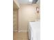 Laundry room with washer, dryer, and storage shelves at 6402 S Goldenrod Rd # 1B, Orlando, FL 32822