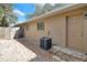 Back exterior of house with small backyard and AC unit at 725 Northlake Blvd # 45, Altamonte Springs, FL 32701