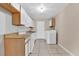 Galley kitchen with washer and dryer hookups at 725 Northlake Blvd # 45, Altamonte Springs, FL 32701