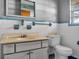 Small bathroom with vintage vanity, toilet and shower at 9745 Ne 306Th Ct, Fort Mc Coy, FL 32134