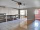 Large garage with overhead door, shelving and additional storage at 9745 Ne 306Th Ct, Fort Mc Coy, FL 32134