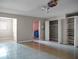 Spacious garage with ceiling fan, shelving and additional storage at 9745 Ne 306Th Ct, Fort Mc Coy, FL 32134