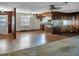 Open living and kitchen area with wood flooring and cabinets at 9745 Ne 306Th Ct, Fort Mc Coy, FL 32134