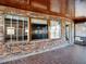 Brick sunroom with wood ceiling and multiple windows at 9745 Ne 306Th Ct, Fort Mc Coy, FL 32134
