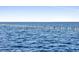 Calm water view with a series of posts in the distance at 9745 Ne 306Th Ct, Fort Mc Coy, FL 32134