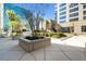 Landscaped courtyard with lush greenery and seating areas at 155 S Court Ave # 2609, Orlando, FL 32801
