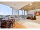Modern dining area with city views and hardwood floors at 155 S Court Ave # 2609, Orlando, FL 32801