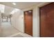 Residential hallway with carpeted floor and wood doors at 155 S Court Ave # 2609, Orlando, FL 32801