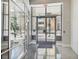 Modern building lobby with glass doors and polished floors at 155 S Court Ave # 2609, Orlando, FL 32801