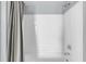 Clean bathroom with white tiled walls and bathtub at 204 E South St # 1055, Orlando, FL 32801