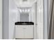 Bathroom with granite vanity and white tiled shower/tub at 204 E South St # 1055, Orlando, FL 32801