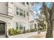 Building exterior with arched entryways and landscaping at 204 E South St # 1055, Orlando, FL 32801