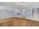 Open living area with hardwood floors and neutral walls at 204 E South St # 1055, Orlando, FL 32801