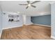 Spacious living room with hardwood floors and a ceiling fan at 204 E South St # 1055, Orlando, FL 32801
