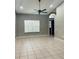 Bright living room featuring tile flooring and ceiling fan at 218 Meadow Green Dr, Davenport, FL 33837