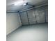 Attached garage with painted floor and automatic opener at 218 Meadow Green Dr, Davenport, FL 33837