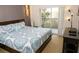Main bedroom with a king-size bed and access to balcony at 3128 Sun Lake Ct # A, Kissimmee, FL 34747
