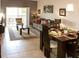 Open concept dining area with table and chairs at 3128 Sun Lake Ct # A, Kissimmee, FL 34747