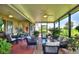 Relaxing screened porch with seating and brick flooring at 4002 Bedford Ave, Winter Haven, FL 33884