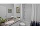 Clean bathroom with granite countertop, bathtub, and shower at 4185 Singing Mockingbird Blvd, Bartow, FL 33830